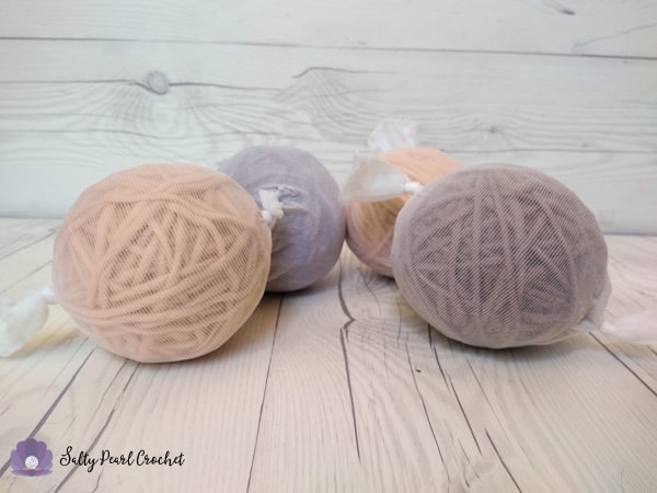 Learn how you can make your own wool dryer balls with half the wool! Thrifty, environmentally friendly, and pretty to boot!