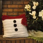 Find the free crochet pattern for this fun Snowman Pillow Sham at SaltyPearlCrochet.com!