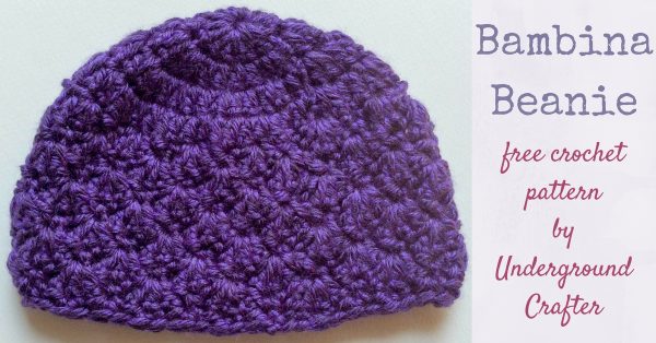 purple crochet newborn size beanie with a textured shell stitch
