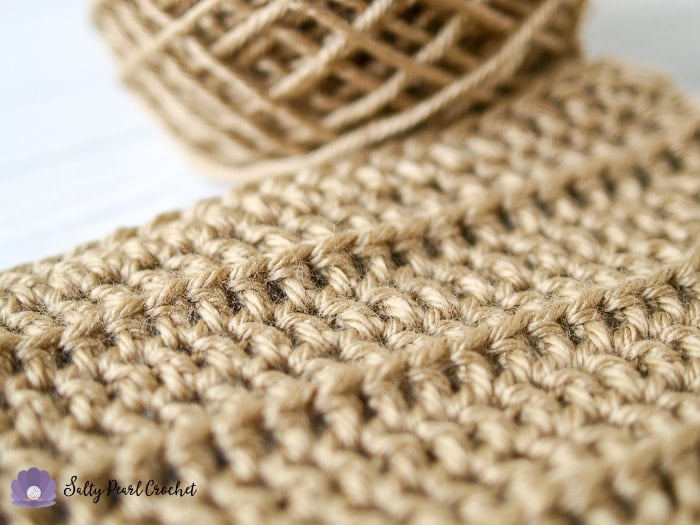 Closeup of the base layer of the crochet fringe clutch.