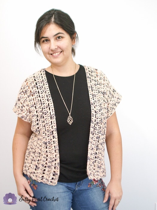 Woman wearing a sweater made from an easy crochet cardigan pattern for beginners