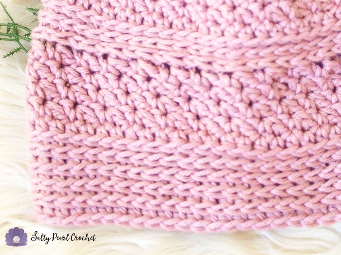 Closeup of a pink hat made from Linda's Easy Crochet Chemo Cap Pattern to show the texture of the cotton yarn.