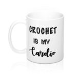 A coffee mug with "Crochet is my Cardio" written on it.
