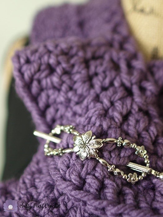 Photo of a Lilla Rose Flexi Clip used as a shawl pin on a ruffle scarf