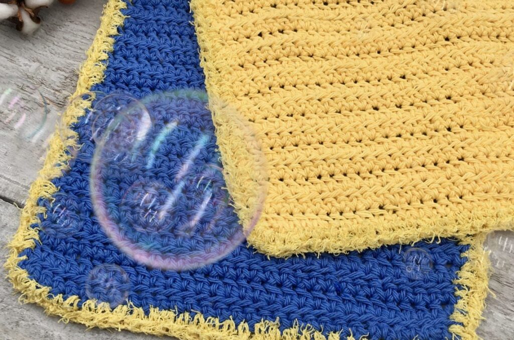 Blue and yellow crochet dishcloths with a bubble