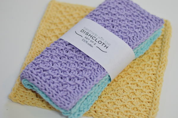Tunisian crochet dishcloths displayed with a printed sleeve.