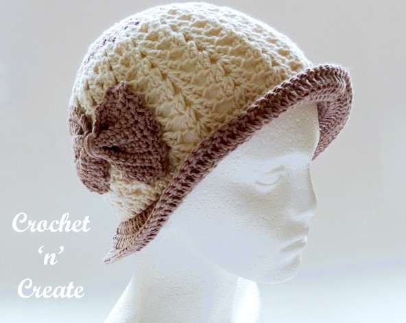 Cream crochet brimmed hat on a mannequin head.  