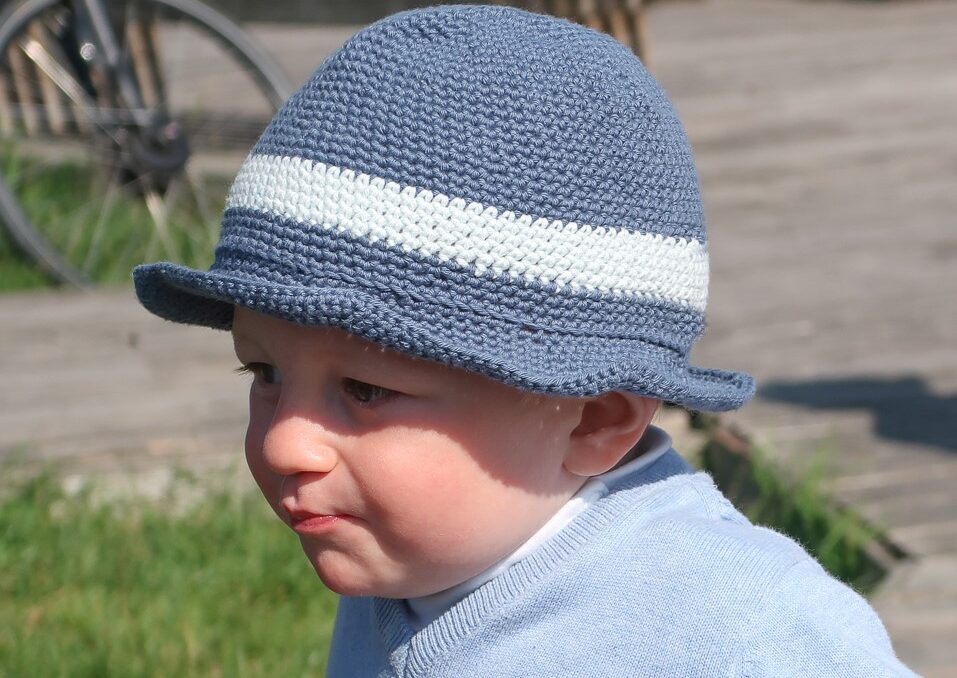 Baby wearing a summer bucket hat.