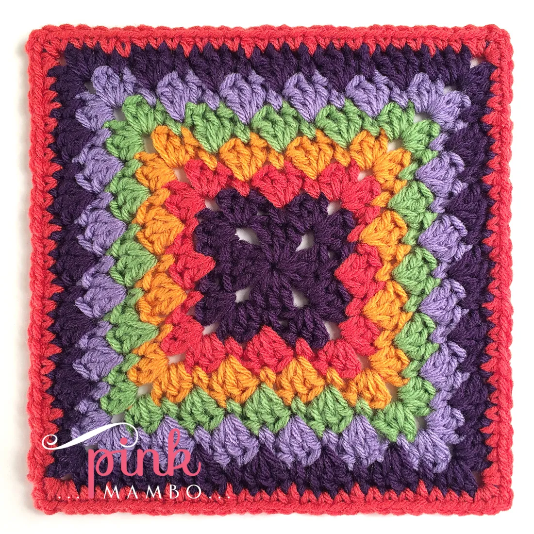 A colorful afghan square on white background. 