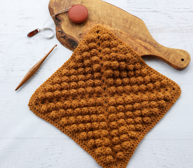 a crochet blanket square using the crochet bobble stitch