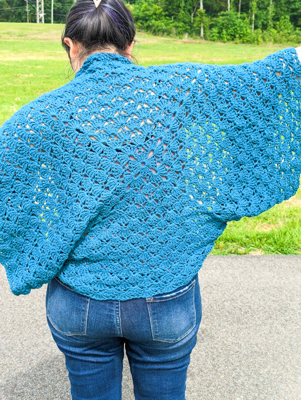 a closeup of the venus shell stitch from a crochet cocoon cardigan pattern