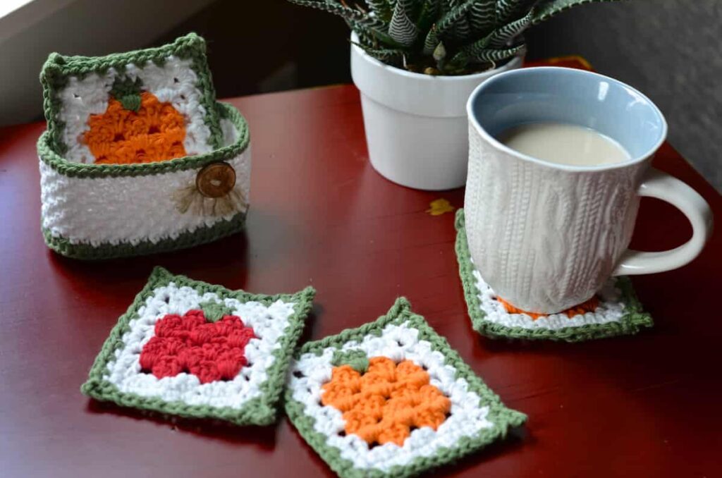 A set of crochet coasters displayed on a table with a cup of coffee on one of the crochet coasters.